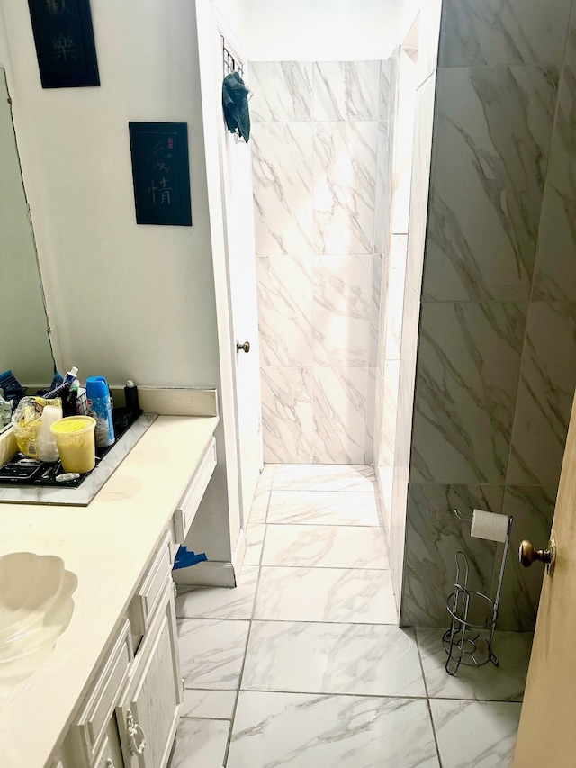 bathroom featuring vanity and marble finish floor