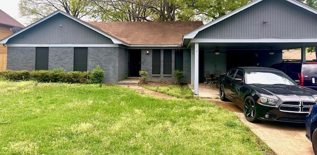 ranch-style house featuring a carport, brick siding, and a front lawn