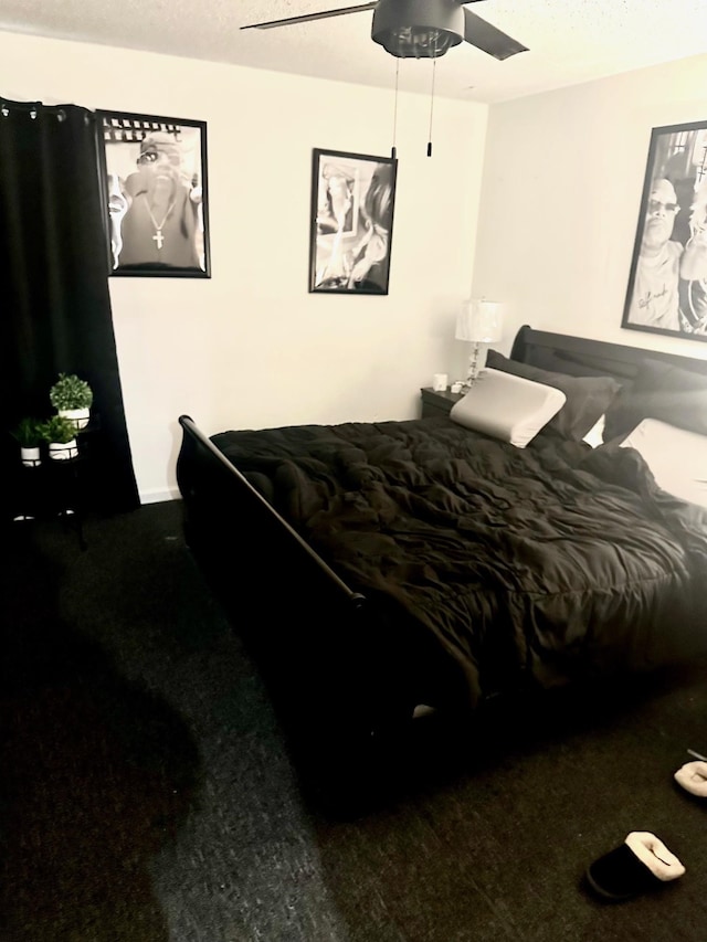 bedroom featuring baseboards and a ceiling fan