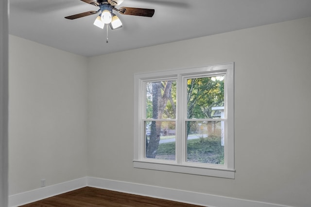 137 W S St, Dyer, TN 38330 - unfurnished room featuring baseboards, ceiling fan, and dark wood-style floors