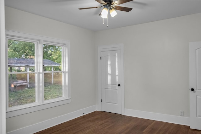 137 W S St, Dyer, TN 38330 - empty room with a ceiling fan, baseboards, and dark wood finished floors