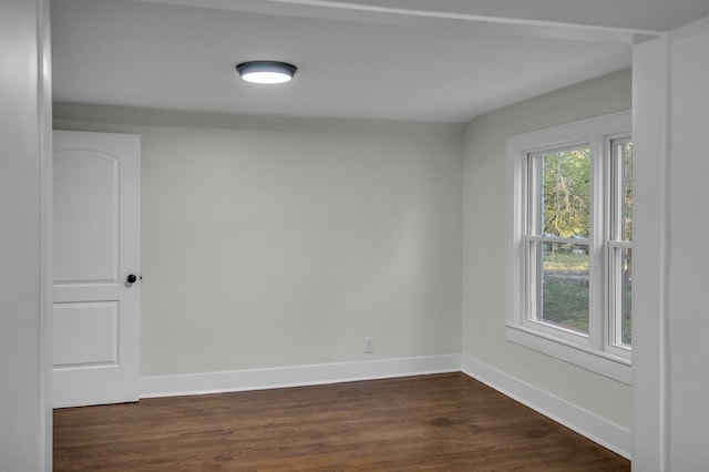 137 W S St, Dyer, TN 38330 - spare room featuring dark wood-type flooring and baseboards
