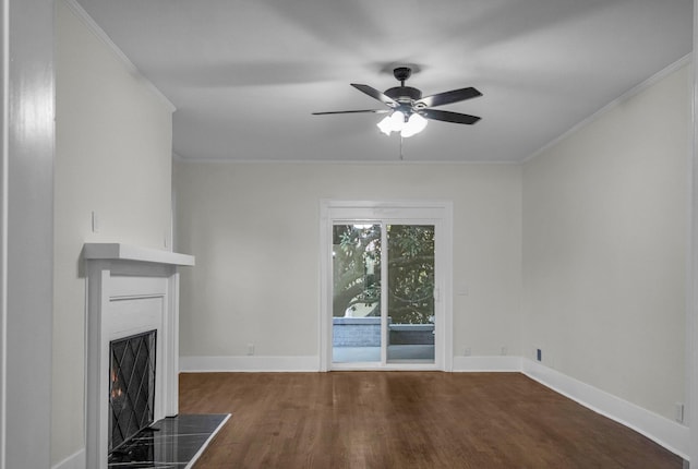 137 W S St, Dyer, TN 38330 - unfurnished living room with a warm lit fireplace, ceiling fan, wood finished floors, and baseboards