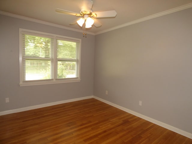 unfurnished room with baseboards, ornamental molding, a ceiling fan, and wood finished floors