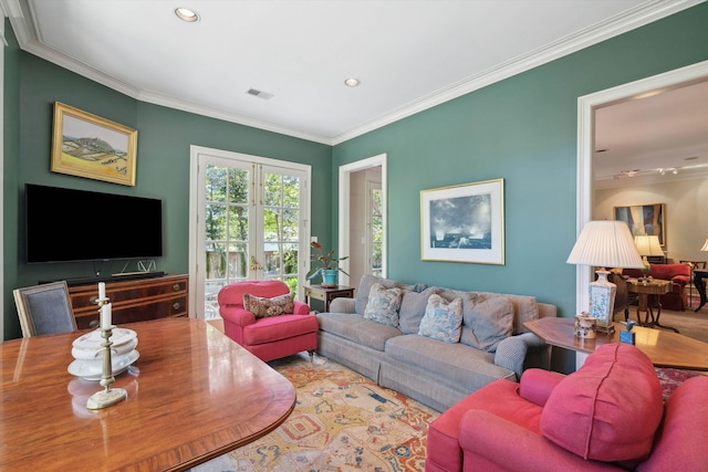 living room featuring crown molding, visible vents, and recessed lighting