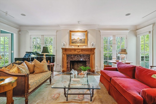 living room with crown molding and a high end fireplace