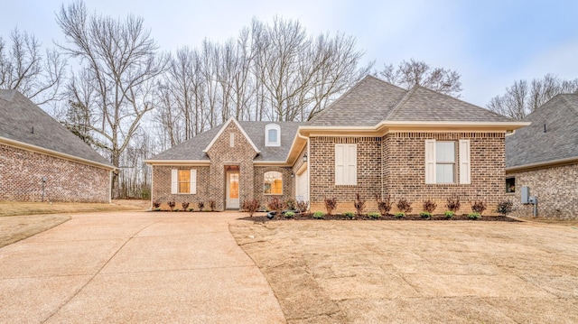 185 Valleyview Ln, Oakland, TN 38060 - ranch-style house featuring concrete driveway, brick siding, and a shingled roof