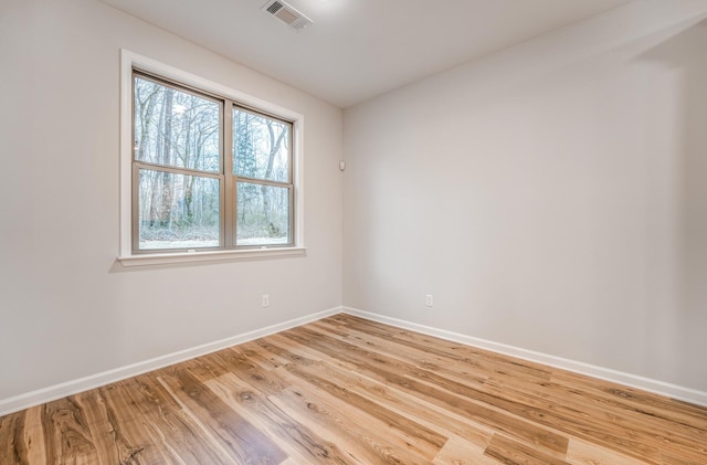185 Valleyview Ln, Oakland, TN 38060 - spare room with visible vents, baseboards, light wood-style flooring, and a healthy amount of sunlight