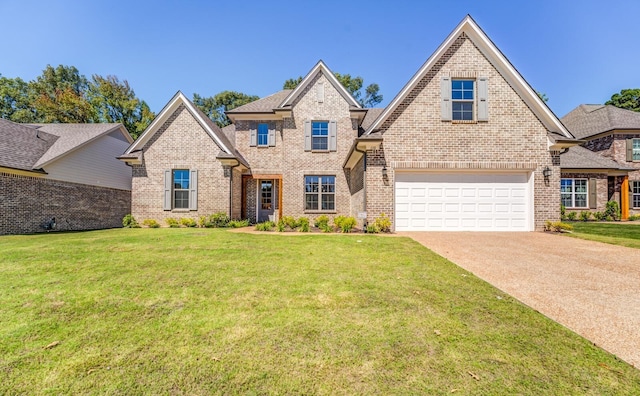 175 Valleyview Ln, Oakland, TN 38060 - view of front facade with brick siding, a front lawn, an attached garage, and concrete driveway