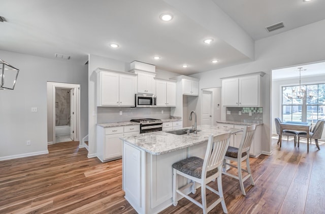175 Valleyview Ln, Oakland, TN 38060 - kitchen with wood finished floors, a sink, visible vents, and stainless steel appliances