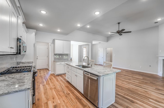 175 Valleyview Ln, Oakland, TN 38060 - kitchen featuring a sink, ceiling fan, light wood finished floors, stainless steel appliances, and backsplash