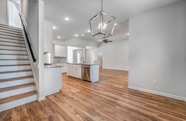 175 Valleyview Ln, Oakland, TN 38060 - kitchen featuring baseboards, open floor plan, light wood-style flooring, white cabinetry, and dishwasher