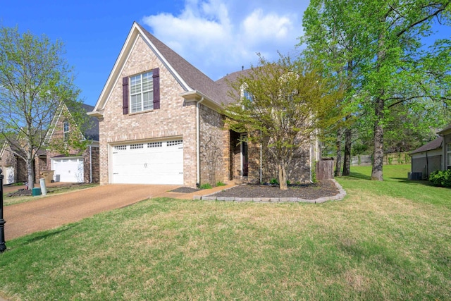 traditional-style home with brick siding, a front lawn, a garage, and concrete driveway