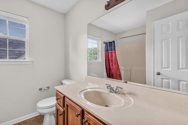 full bathroom featuring toilet, baseboards, tile patterned flooring, curtained shower, and vanity