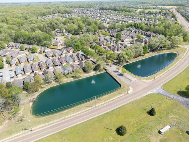 bird's eye view with a water view and a residential view