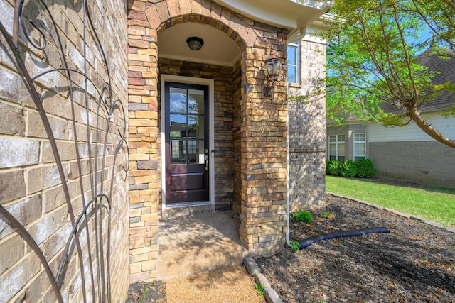 view of exterior entry featuring stone siding