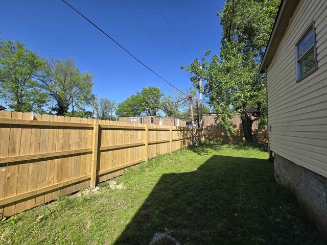 view of yard featuring a fenced backyard