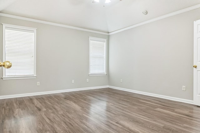 unfurnished room featuring crown molding, wood finished floors, ceiling fan, and baseboards