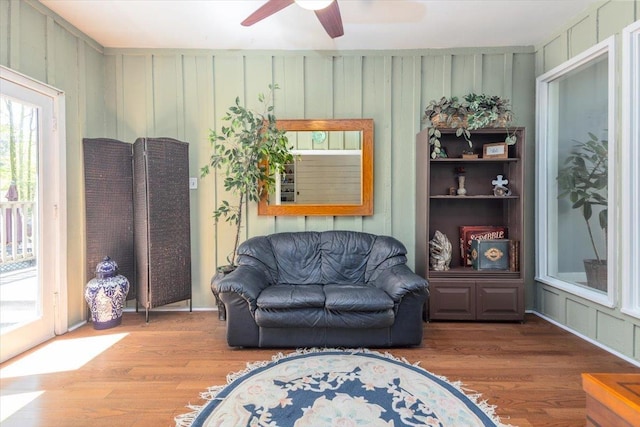living area featuring ceiling fan and wood finished floors