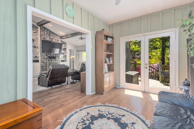 doorway to outside with french doors, ceiling fan, vaulted ceiling with beams, and wood finished floors