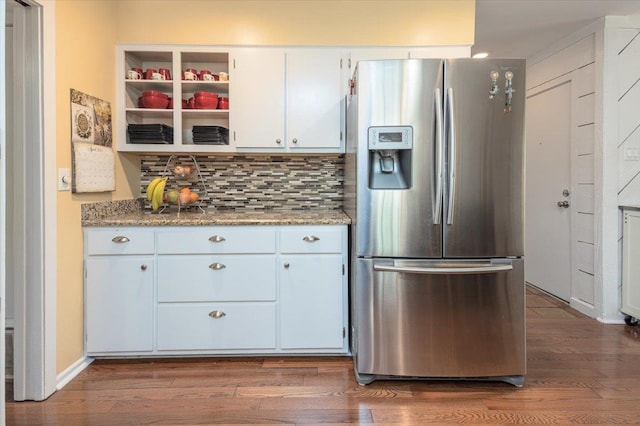 kitchen with tasteful backsplash, dark wood-style flooring, baseboards, white cabinetry, and stainless steel refrigerator with ice dispenser