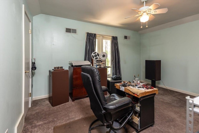 office area with visible vents, baseboards, a ceiling fan, and carpet