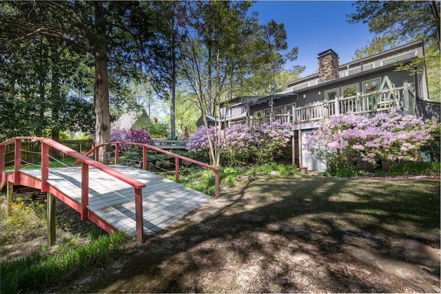 view of yard featuring a wooden deck