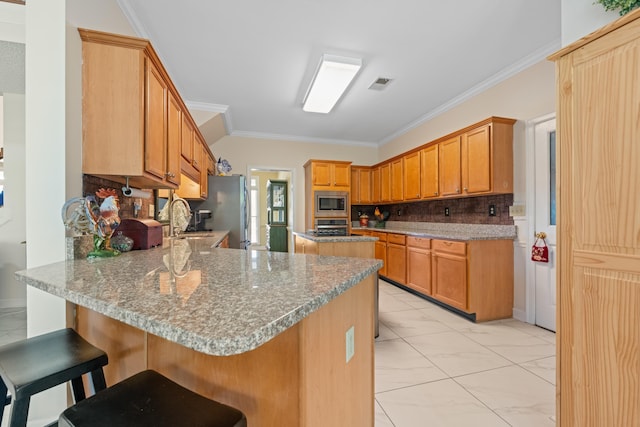 kitchen featuring a peninsula, crown molding, visible vents, appliances with stainless steel finishes, and marble finish floor