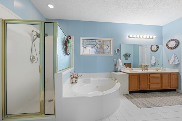 bathroom featuring a whirlpool tub, a shower stall, and a textured ceiling