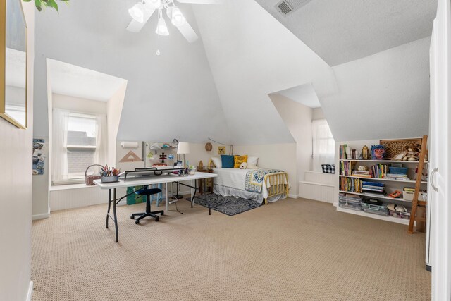 bedroom with multiple windows, carpet flooring, and vaulted ceiling