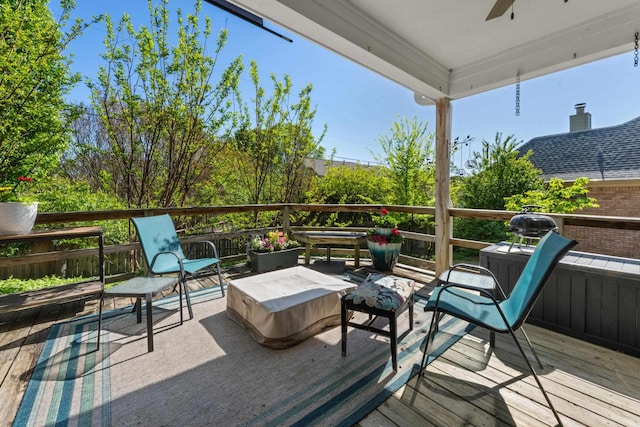 deck featuring an outdoor living space and ceiling fan