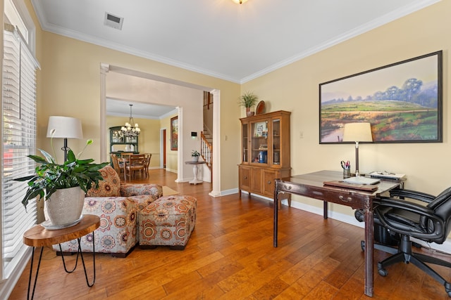 office area with baseboards, ornamental molding, a chandelier, visible vents, and wood-type flooring