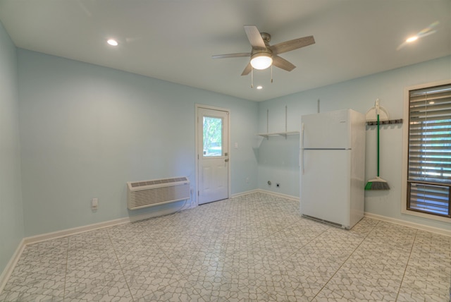 empty room with ceiling fan, baseboards, a wall mounted AC, and recessed lighting