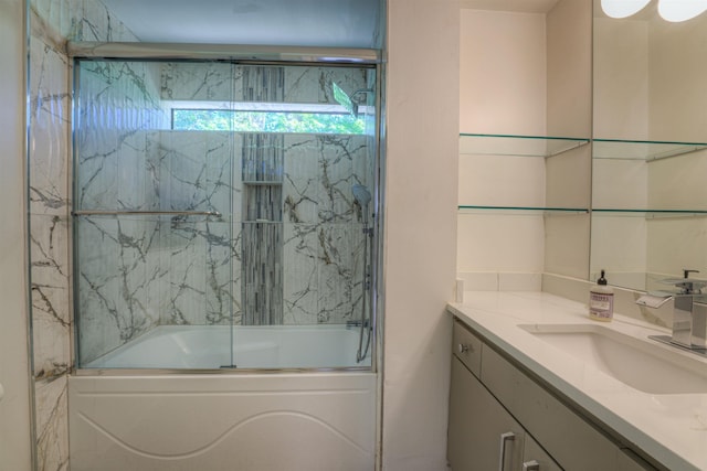 full bath with enclosed tub / shower combo and vanity