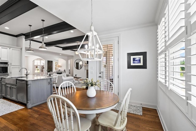 703 Justana Dr, Collierville, TN 38017 - dining area with crown molding, arched walkways, baseboards, dark wood-style floors, and recessed lighting