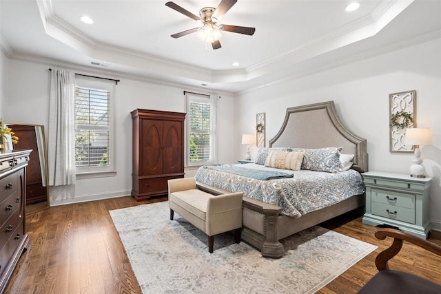 703 Justana Dr, Collierville, TN 38017 - bedroom with dark wood-style floors, crown molding, a tray ceiling, and visible vents