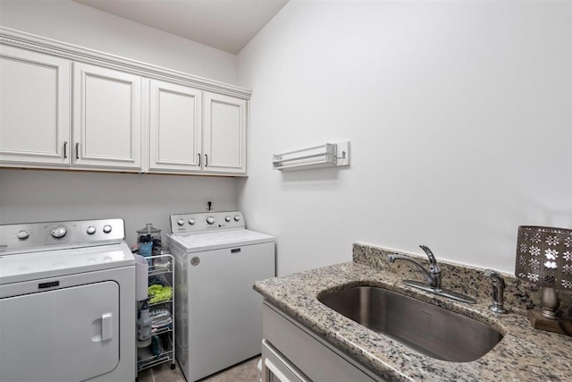 703 Justana Dr, Collierville, TN 38017 - laundry room featuring cabinet space, independent washer and dryer, and a sink