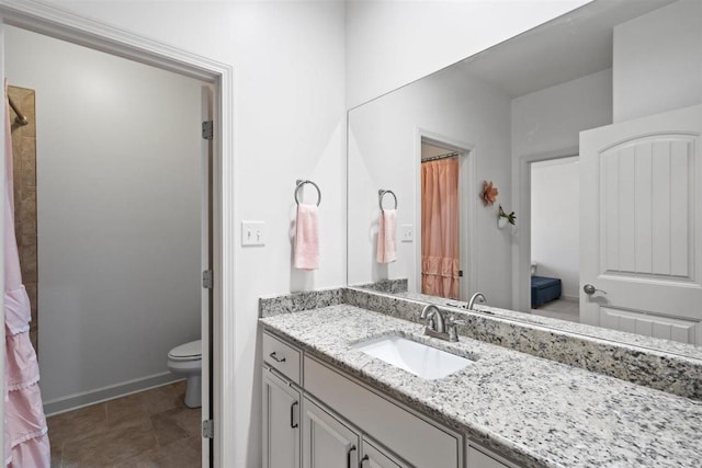 703 Justana Dr, Collierville, TN 38017 - bathroom featuring baseboards, vanity, and toilet