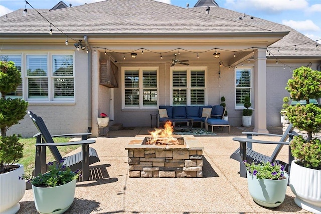 703 Justana Dr, Collierville, TN 38017 - back of house featuring a shingled roof, ceiling fan, a patio area, an outdoor living space with a fire pit, and brick siding