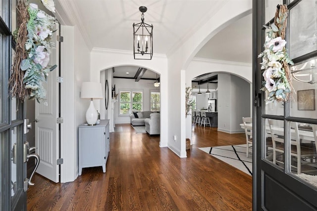 703 Justana Dr, Collierville, TN 38017 - entrance foyer with arched walkways, crown molding, and wood finished floors