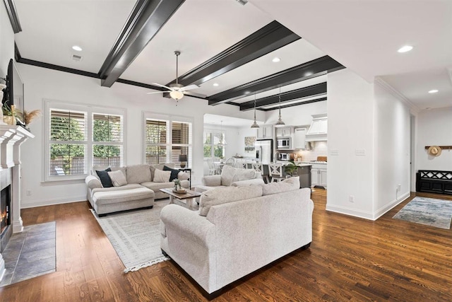 703 Justana Dr, Collierville, TN 38017 - living area with beam ceiling, a ceiling fan, baseboards, and a wealth of natural light