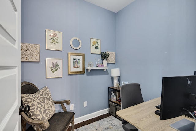 office area featuring baseboards and wood finished floors