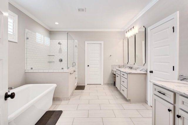 full bathroom with a shower stall, vanity, a freestanding bath, ornamental molding, and recessed lighting