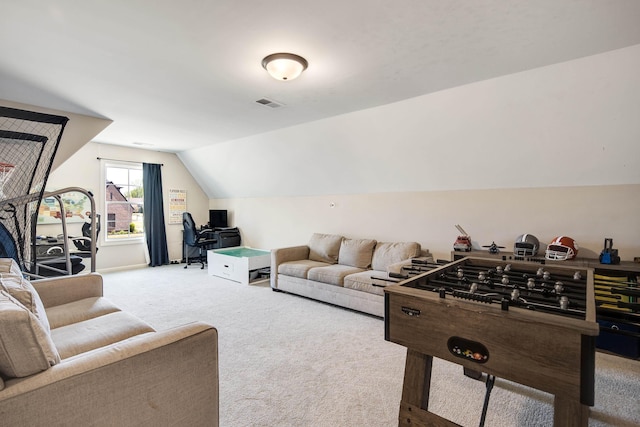 rec room featuring vaulted ceiling, carpet, and visible vents