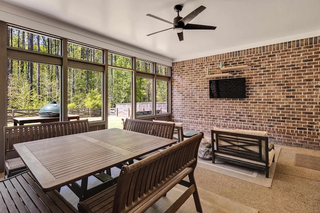 sunroom / solarium featuring an outdoor hangout area, a ceiling fan, and outdoor dining space