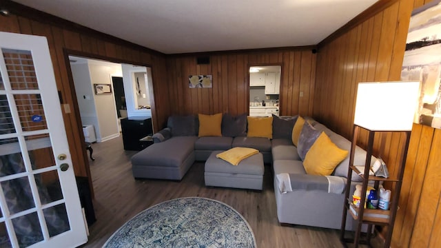 living room with wooden walls and wood finished floors