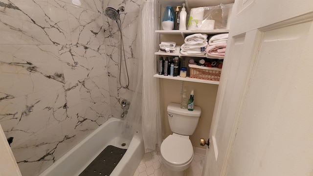 bathroom with toilet, tile patterned flooring, and shower / bath combo with shower curtain