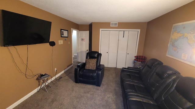 carpeted living area featuring baseboards and visible vents