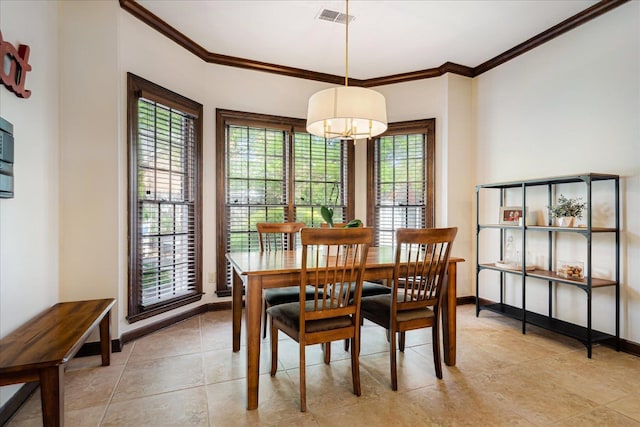 dining space featuring visible vents, baseboards, and crown molding