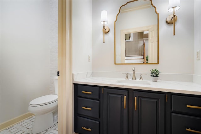bathroom featuring vanity and toilet